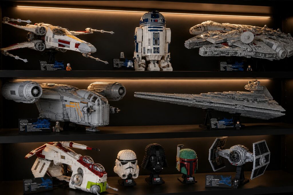 LEGO Star Wars sets on display shelf — Millennium Falcon, X-Wing and Death Star